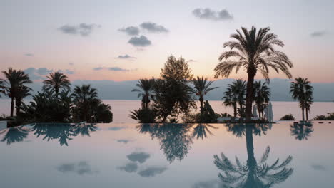 steadicam shot of evening view near a swimming pool