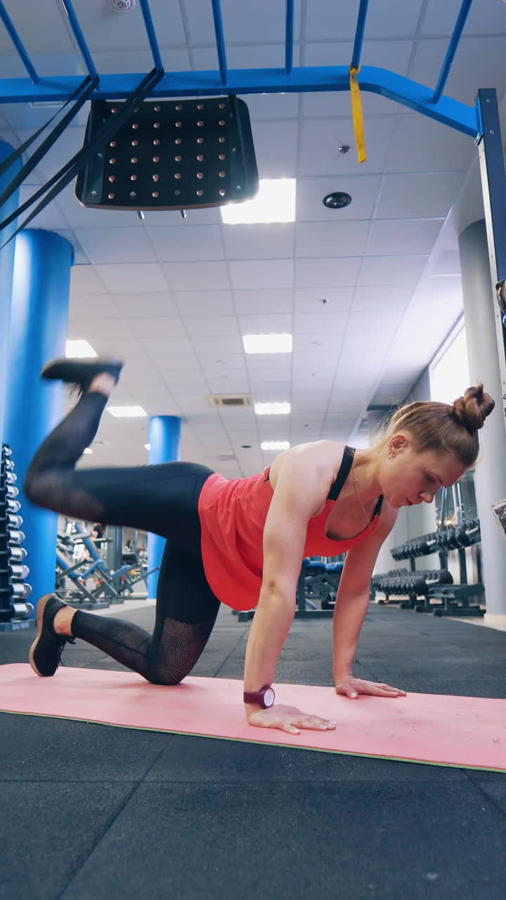 Woman doing workout. Young fitness woman exercise in gym