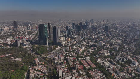 mexico city aerial v50 dolly in shot drone flyover la condesa, juarez and roma norte neighborhoods capturing densely populated downtown cityscape on a hazy day - shot with mavic 3 cine - december 2021