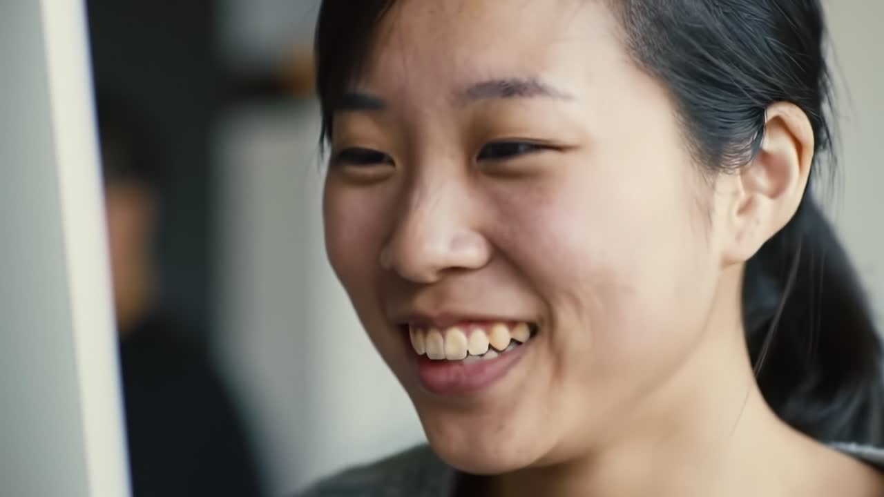 Joyful Expression: Capturing the Warmth and Enthusiasm of a Young Woman's Smile in Two Moments of Laughter and Connection