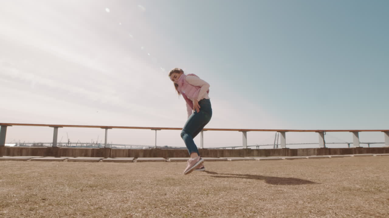 Woman Performing Modern Dance Moves Outdoors