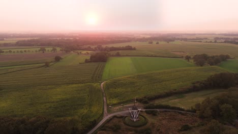 aerial view of dutch farmland and windmill at sunrise/sunset