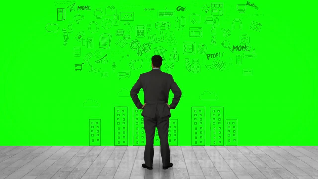 초록색 인터페이스를 보는 사업가