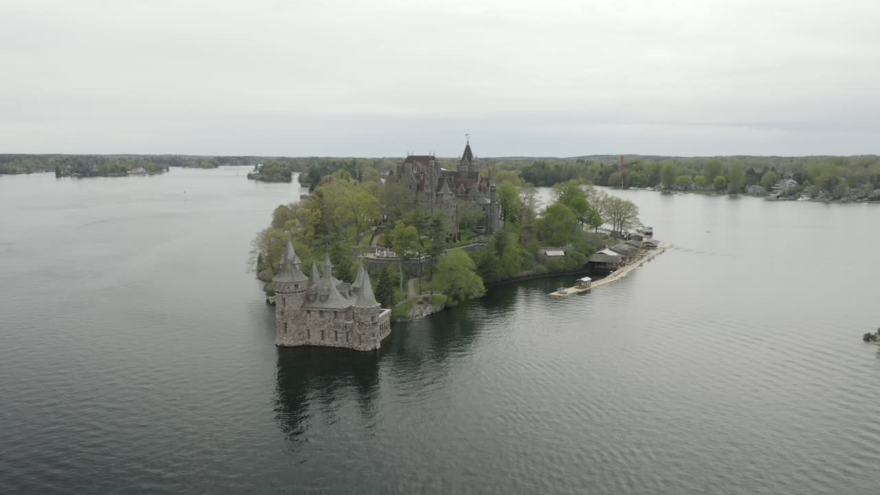 Drone shot of a castle in Thousand Islands, flying down, to the right and panning to the left