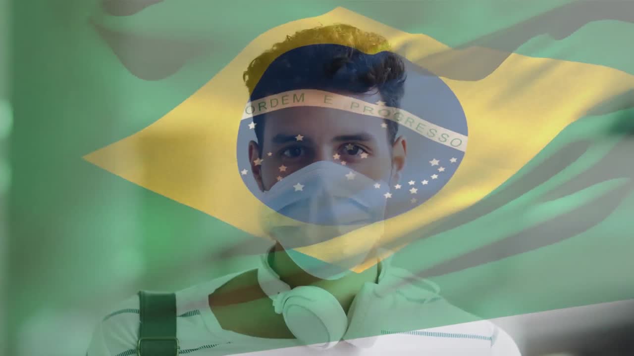 animación de la bandera de brasil ondeando sobre un hombre latino con máscara facial en la calle de la ciudad