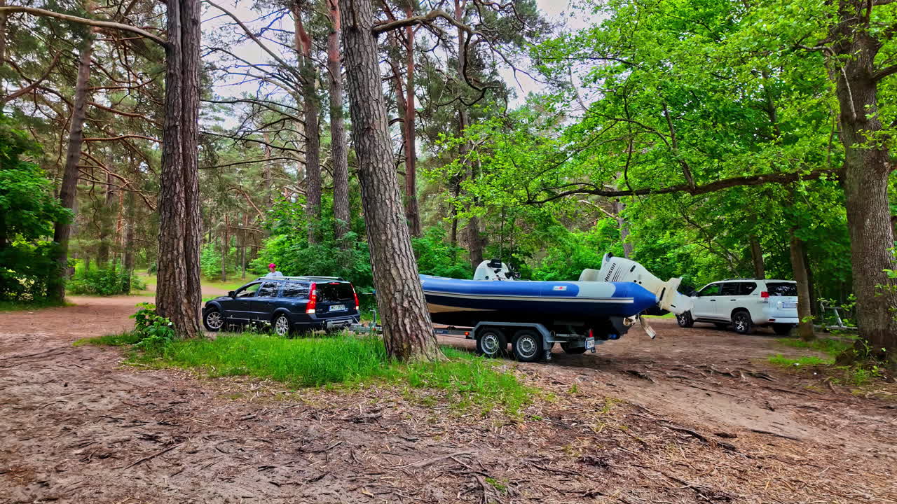 A peaceful camping experience in the forest with a boat launch ready for exciting lake adventures.