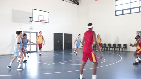 basketball players practicing teamwork on indoor court, preparing for game