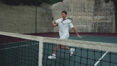 man playing tennis on a sunny day