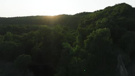 Early-Morning-Sunlight-Illuminated-Over-Forests-And-Zumbro-Lake-Dam-In-Minnesota,-United-States