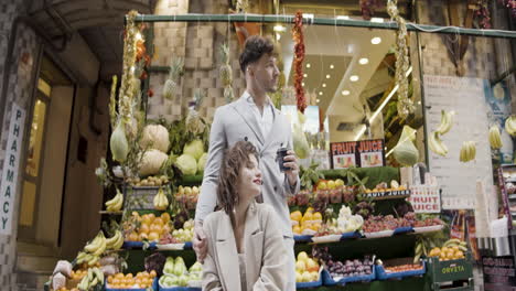 couple enjoying coffee at a fruit market