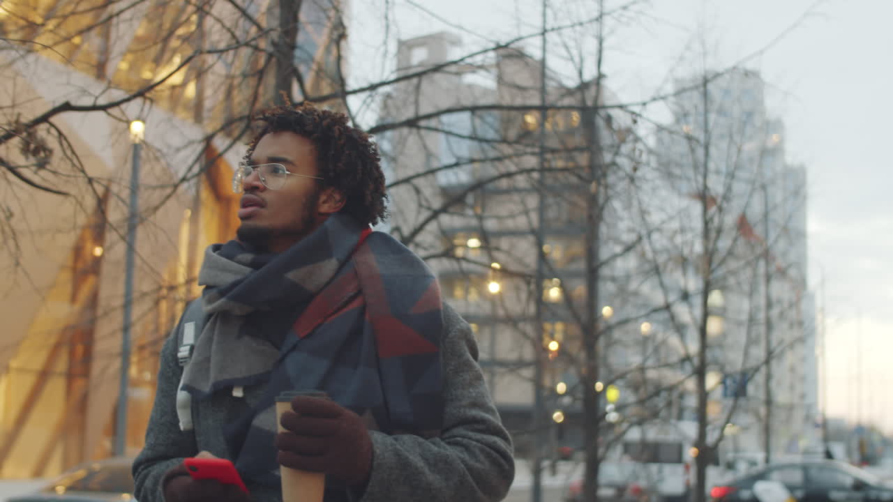 Man Walking in City During Winter