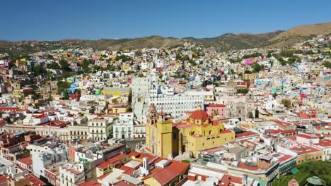 drone flies above guanajuato city center