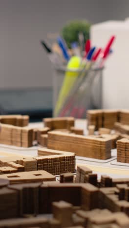 vertical video close up of urban developers showing master plan for residential layout project