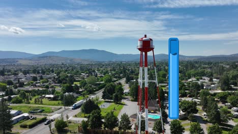 Aerial-view-of-a-full-water-tower-standing-tall-over-Spokane,-Washington