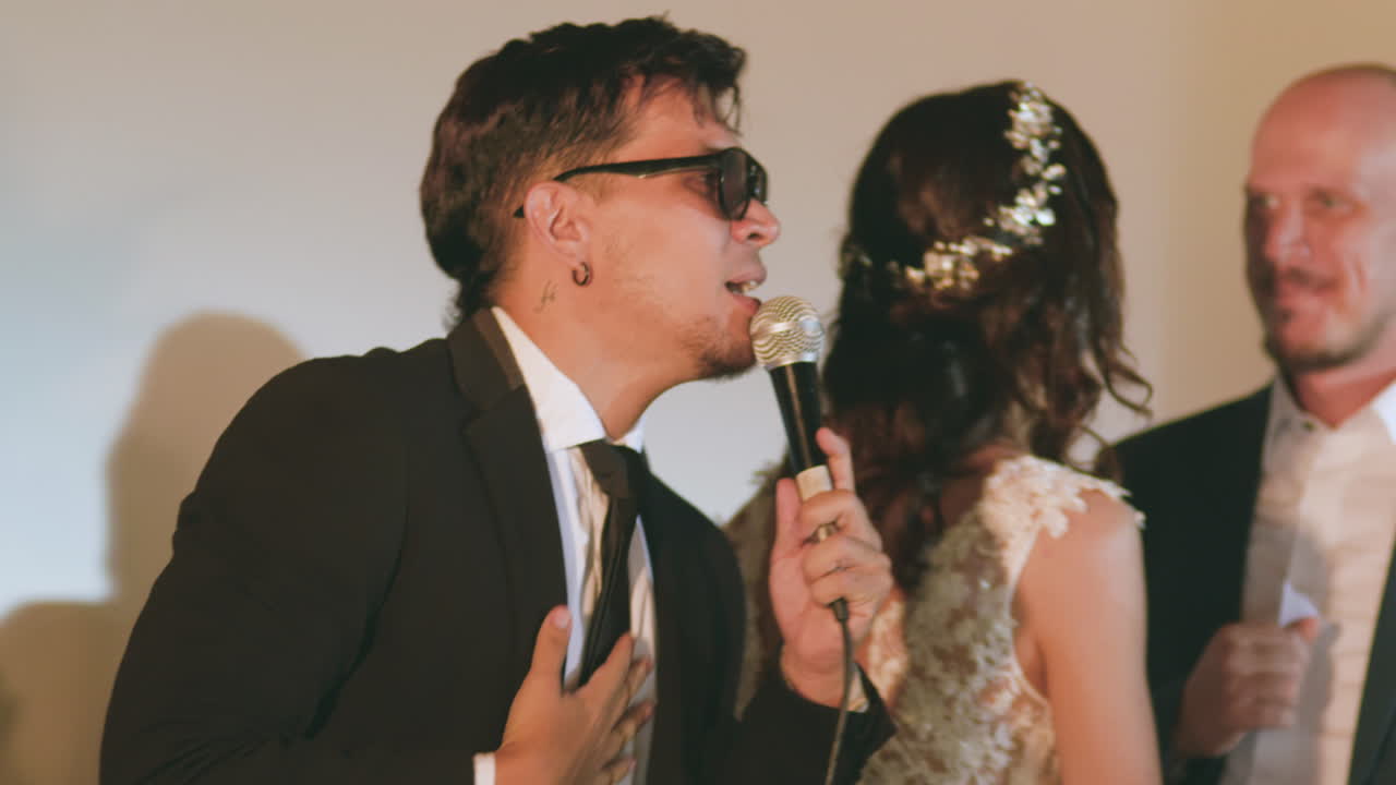 Clip of a musical band performing live at a social event or party.