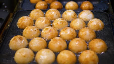 a close up of deep fried dough balls