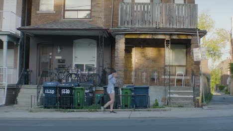 girl walking out of house