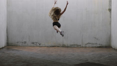 dancing-woman-beautiful-young-caucasian-street-dancer-performing-contemporary-moves-enjoying-modern-dance-expression-practicing-in-grungy-warehouse