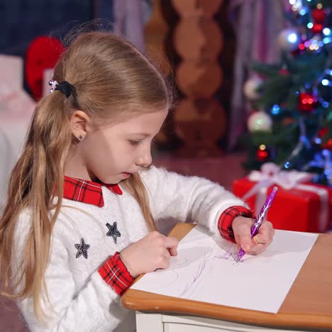 little girls during christmas time. happy little girls drawing picture for santa claus