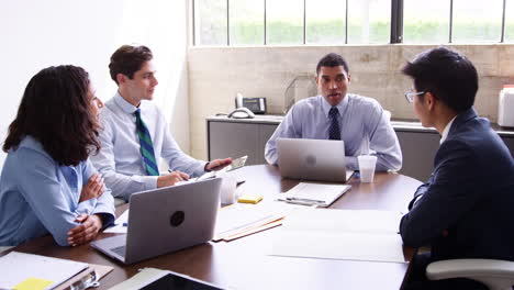 Mixed-race-businessman-holds-a-meeting-with-colleagues