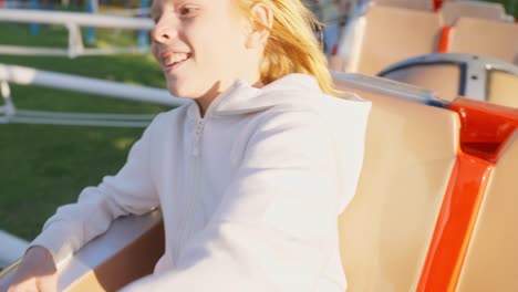 smiling girl on a carousel ride