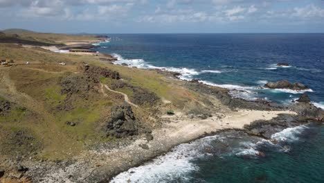 tour-the-beautiful-coastline-of-arikok-national-park,-Aruba,-from-the-air