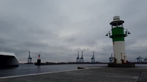 timelapse of two light houses in a busy shipping bay