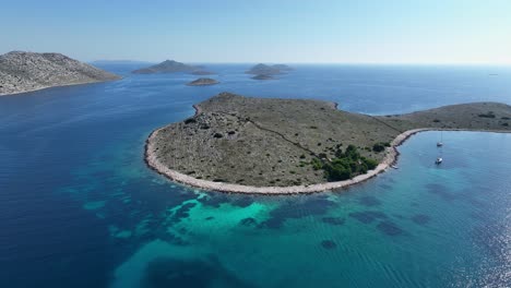 stunning aerial shot of kornati islands, showcasing clear blue water and rugged coastlines.
