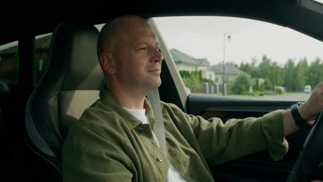 man driving a car