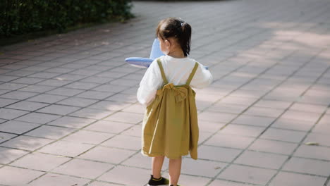 child with blue airplane