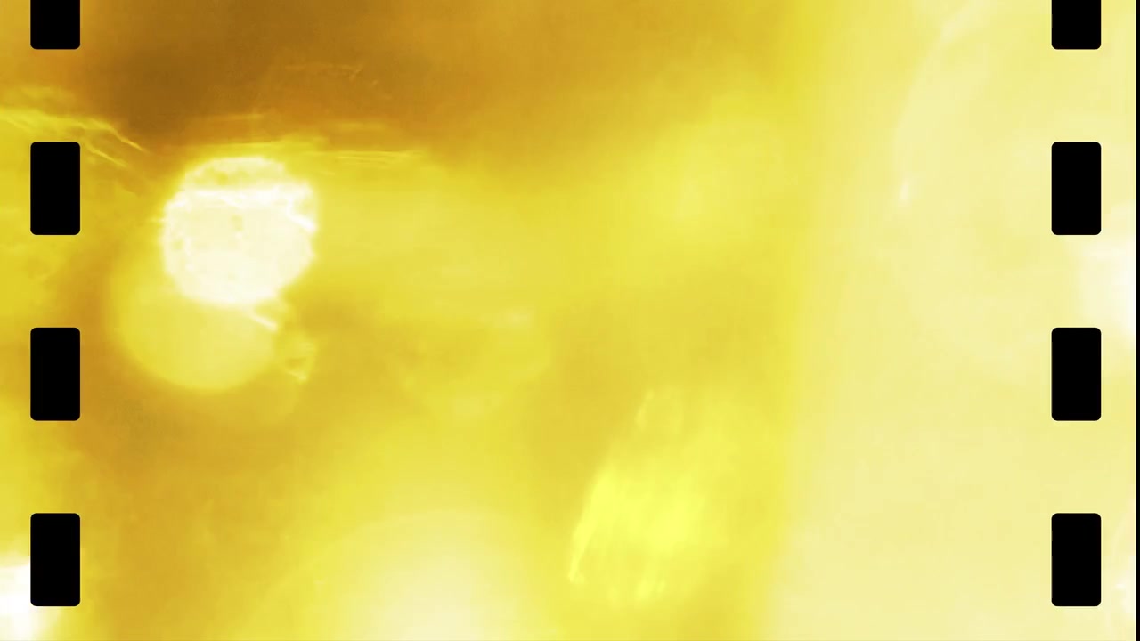 Vintage Film Reel Overlay with Flickering Yellow Light Leaks