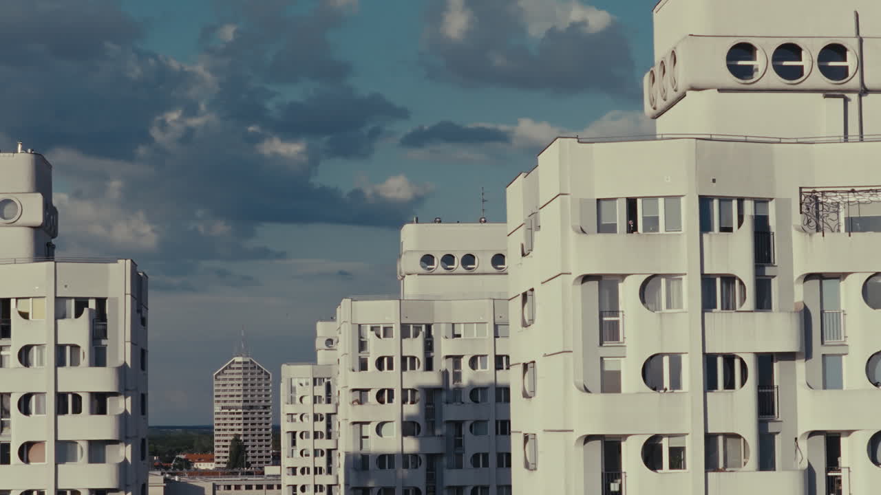 Modern Apartment Buildings under Cloudy Sky