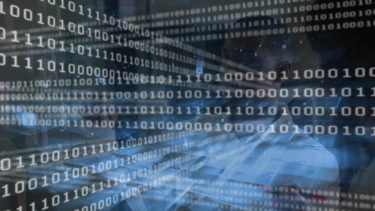 Binary code streaming on desk, data analyst typing, scrolling, reviewing results as overlay dimming
