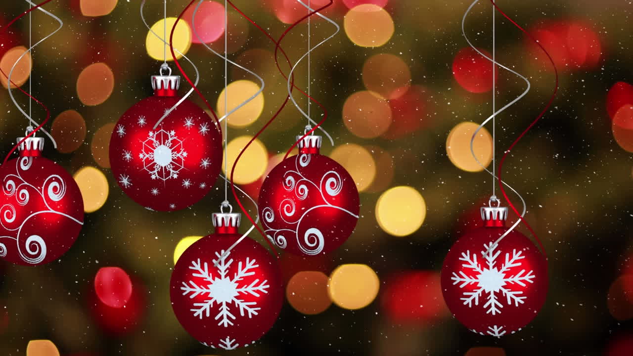 animación de nieve cayendo sobre bolas de navidad rojas y luces de hadas parpadeantes