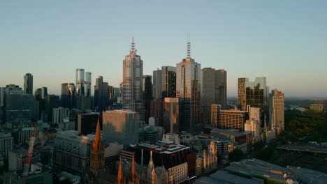 aerial drone video at sunset of the city skyline in melbourne, victoria, australia