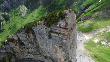 4k drone aerial shot of massive rock structure at shäfler ridge in appenzell region of switzerland