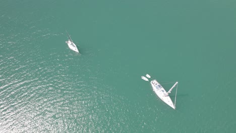 Luxury-Yachts-Sailing-On-Tranquil-Ocean-During-Daytime