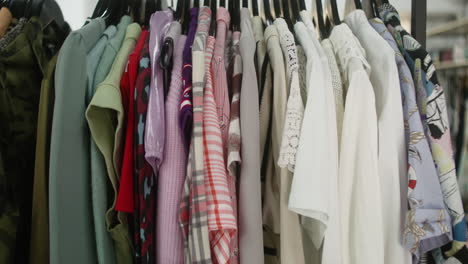 clothes on hangers in a store