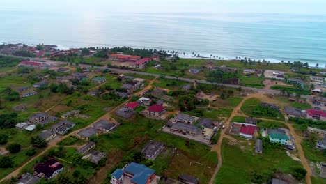 drone footage from land towards the sea