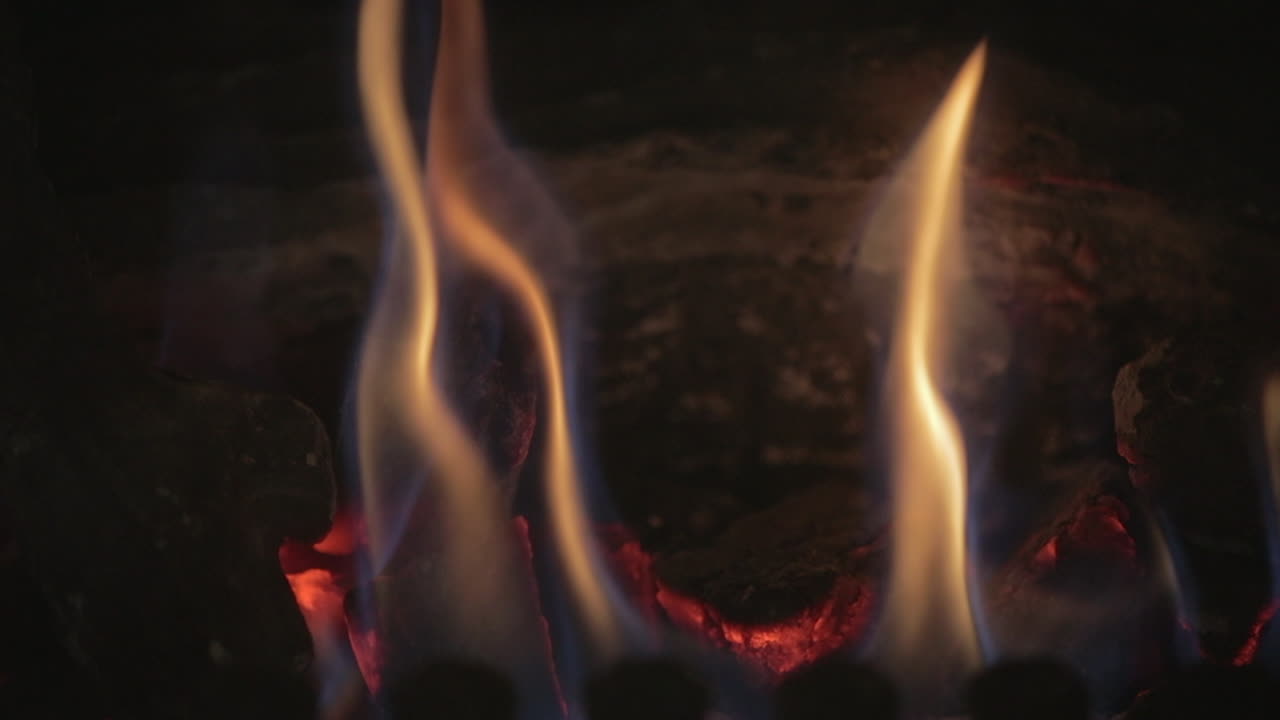 slow motion of fire blazing wood in fireplace