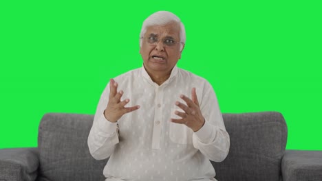 Angry-Indian-old-man-talking-to-the-camera-Green-screen