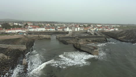 An-aerial-view-of-St-Monans-town-and-the-famous-zig-zag-breakwater,-Fife,-Scotland