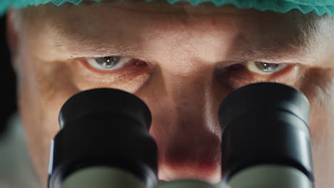 portrait of a scientist working with a microscope in the lab 2