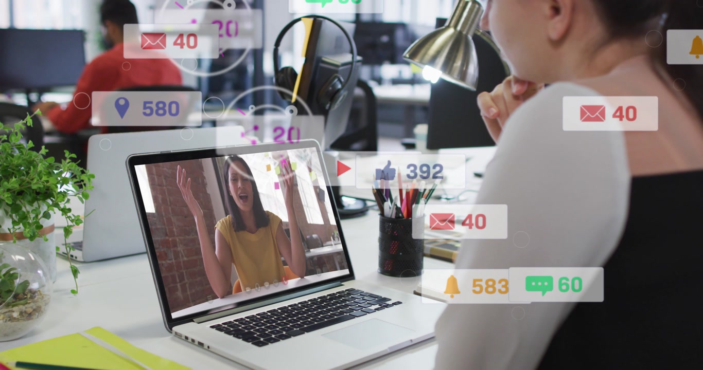 Woman monitoring screen as caller speaking, like or view badges popping over screen, boosting busine