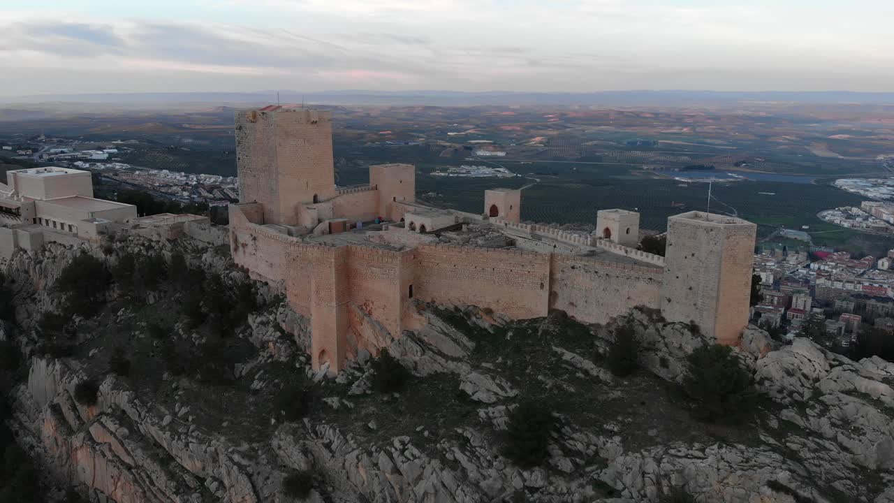 Jaen's Castle Saint Catalina Castle Spain shoot with a drone at 4k 24fps showing the exterior and the city from multiple points on a afternoon in December.