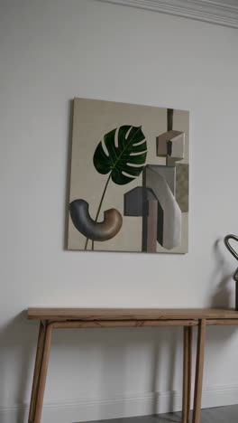 modern home decor featuring abstract art and wooden furniture