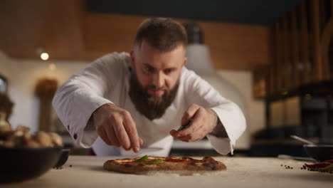 chef making vegetarian pizza in restaurant kitchen. italian food tasty concept.