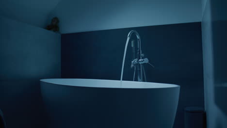 modern bathroom tub filling with water
