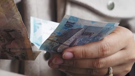 hands holding money