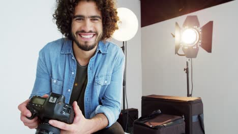 photographer holding digital camera